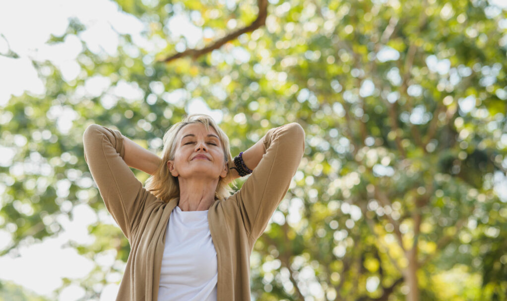 Portrait photo of happy senior Caucasian woman relaxing and brea
